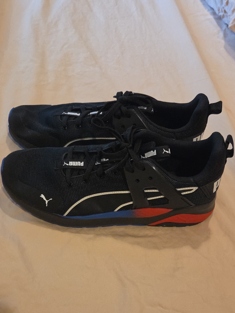 Puma Men's Black Athletic Shoes with Red and Blue Accents